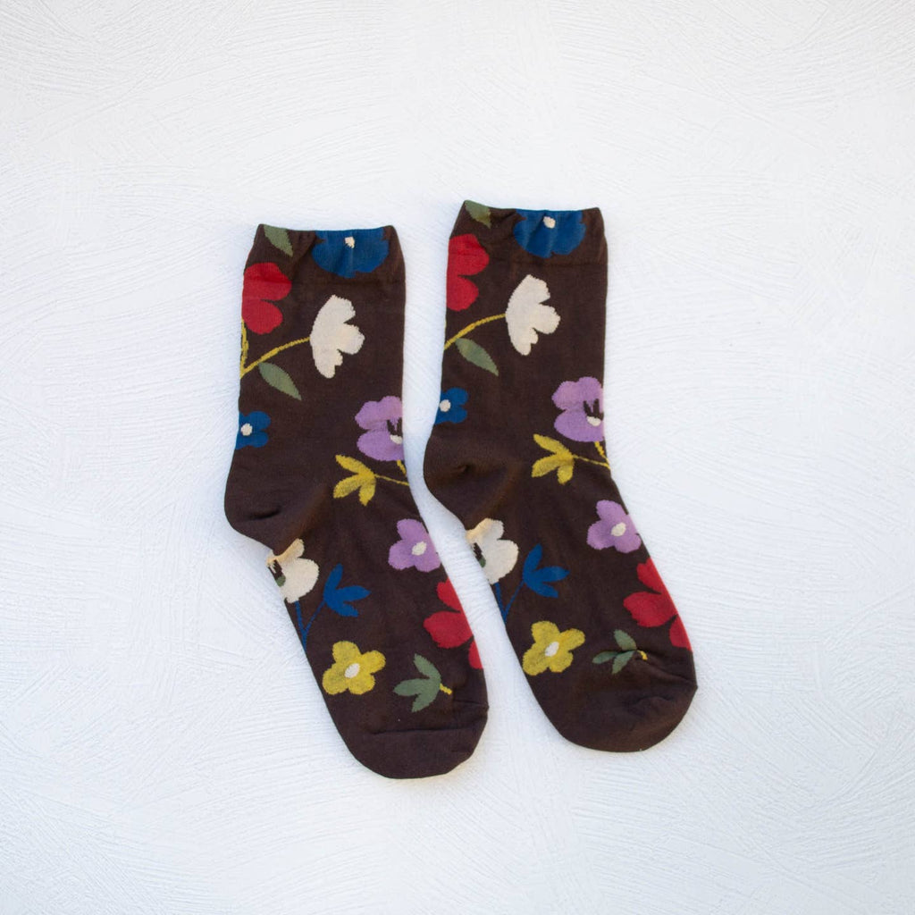 Introducing the Ella Floral Casual Socks, available in dark brown. These socks feature a unique big flower design, adding a touch of fun to any casual outfit. Made with high-quality materials, they offer both style and comfort. Upgrade your sock game today.
