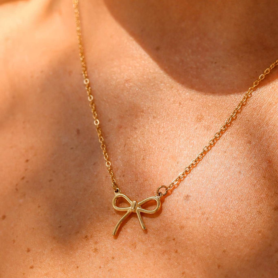 Show off your impeccable style with our charming Bow Connector Charm! This dainty bow charm adds a touch of elegance to any jewelry piece, available in both gold and stainless steel colors. Perfect for accessorizing any outfit and standing out from the crowd!