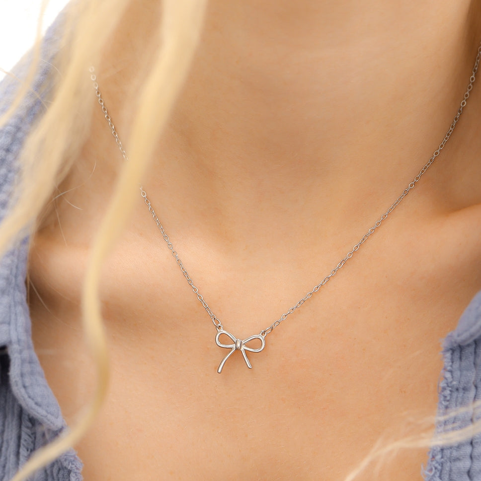 Show off your impeccable style with our charming Bow Connector Charm! This dainty bow charm adds a touch of elegance to any jewelry piece, available in both gold and stainless steel colors. Perfect for accessorizing any outfit and standing out from the crowd!