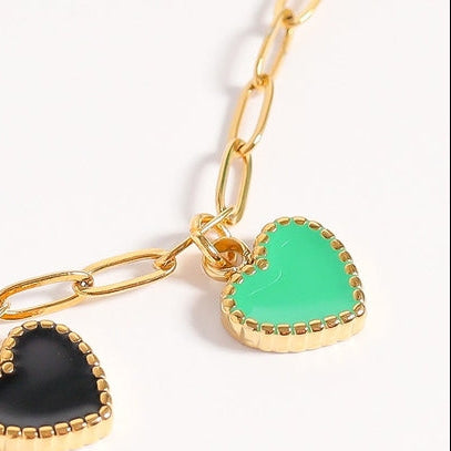 Our 18K Gold PVD Stainless Epoxy Heart Charm is a must have for your charm collection! The epoxy heart design adds a pop of color and a playful touch, making it a versatile addition to charm bracelets and necklaces. Ideal for both everyday wear and special occasions, it’s perfect for those seeking thoughtful gifts to fashion-forward individuals looking to personalize their jewelry. Its easy attachment ensures compatibility with various styles, allowing you to create stunning combinations!