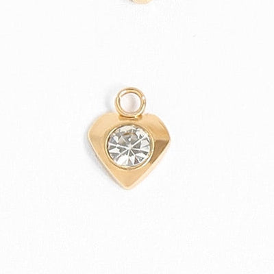 This heart charm is sure to add some sparkle to your jewelry collection. With its subtle yet eye-catching design, it's perfect for adding a touch of glam to any outfit. The single heart charm will be the perfect finishing touch!