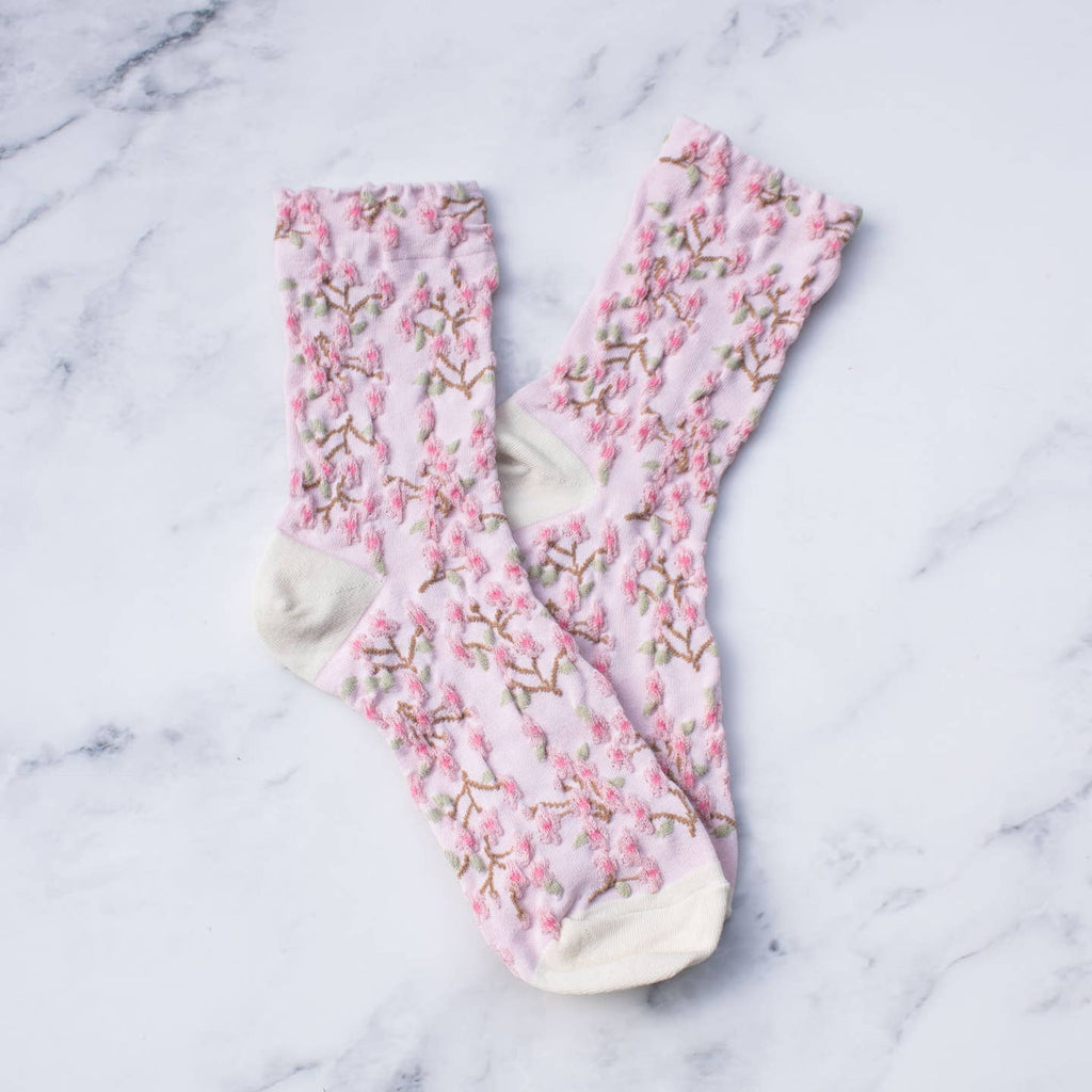 Perfect for adding a vintage and romantic touch to your wardrobe. These socks are not only stylish, but also comfortable and high-quality. Elevate any outfit with these must-have statement pieces.