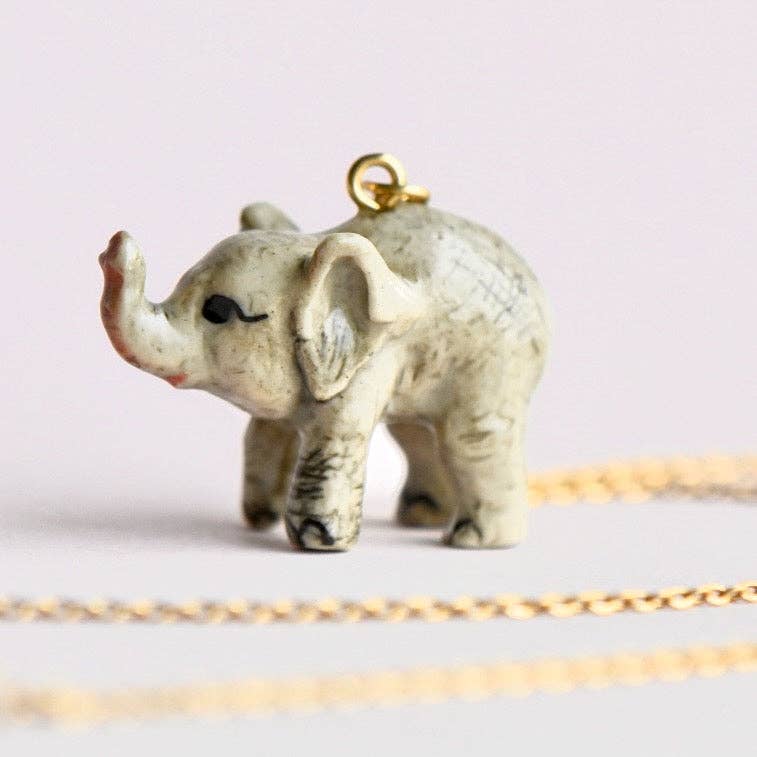 The elephant in the room has never been cuter! Camp Hollow’s porcelain Baby Elephant Necklace shrinks this majestic beauty into a tiny treasure that lives right near your heart.