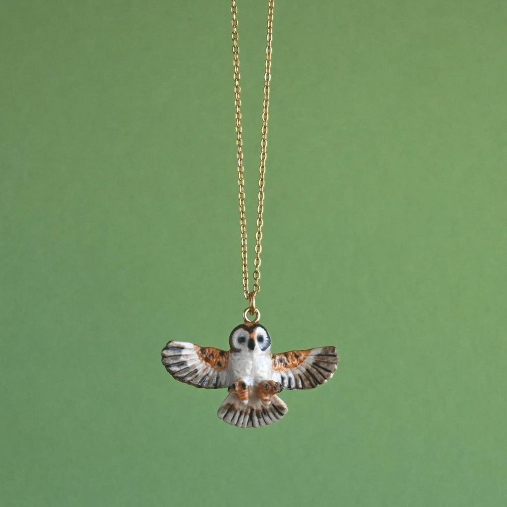 Capture the mystique of the night with our limited-edition  Barn Owl Necklace! This heirloom-quality porcelain pendant features a hand-painted barn owl, capturing the wisdom and magic of this elusive bird. Strung on a delicate chain, this necklace is a versatile and captivating addition to any ensemble. Due to the handmade nature of this product, each piece is truly one-of-a-kind. Perfect for bird enthusiasts, collectors, or anyone who appreciates the blend of fashion, artistry, and natural wonder.