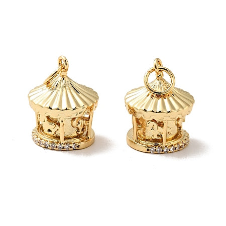 Upgrade your bracelet or necklace with our Gold Carousel Charm. With its stunning gold color and intricate design of a carousel with cubic zirconia details, add a touch of elegance and whimsy to your accessories. Elevate your style and make heads turn with this charming addition.