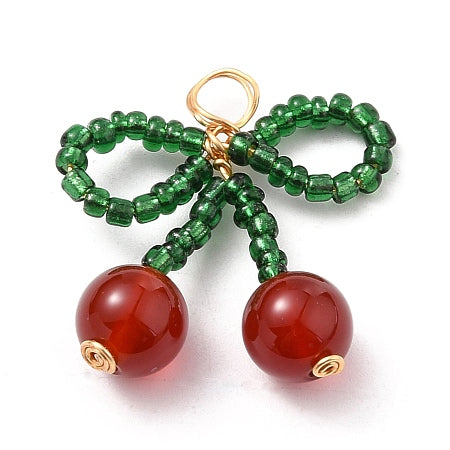 Add a pop of color to your jewelry collection with our Beaded Cherries Charm. The intricate bead details and cherry cluster design make it a versatile addition to any necklace or bracelet. Perfect for adding a touch of fun and sweetness to any outfit.