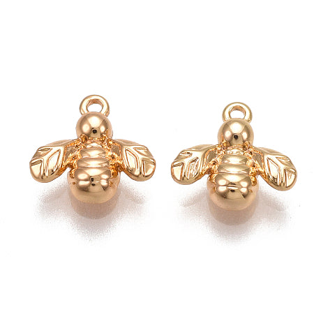 Add a touch of nature to your jewelry with our Gold Bee Charm. The mini bee charm, coated in a stunning gold color, can be used as a bracelet or necklace charm for a versatile and unique accessory. Embrace the beauty of the natural world with this charming addition.