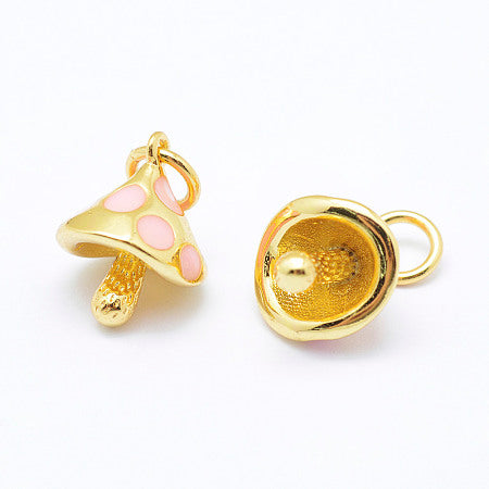 Add a touch of nature to your jewelry collection with our gold Pink Polka Dot Mushroom Charm. Each charm showcases a mushroom with a baby pink enamel color, adding to your accessories a whimsical and enchanting touch.