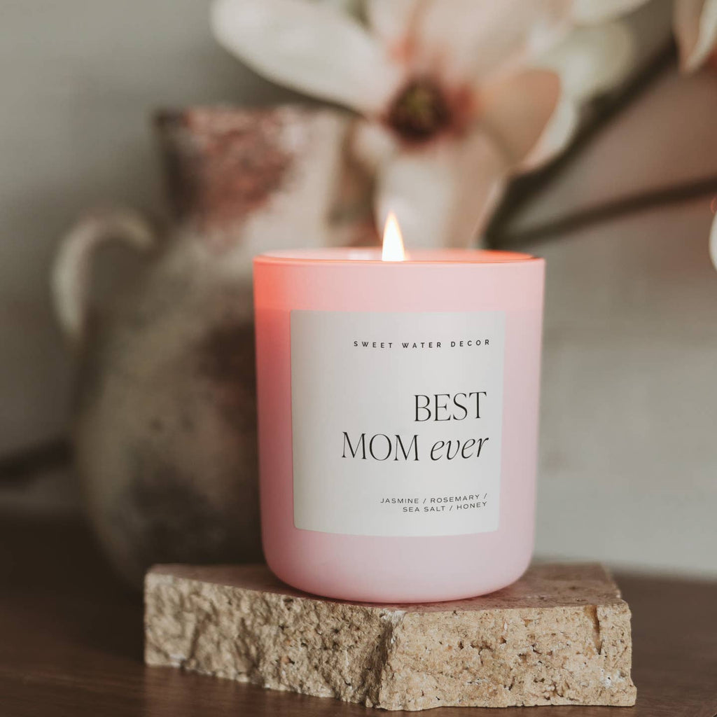 Celebrate the best mom ever with our 15 oz soy candle. The pink container adds a touch of elegance to any room. Perfect for Mother's Day or anytime you want to show some love. Enjoy the soothing flicker and comforting aroma of our candle.

Scent Notes:

Top: Lemon, Rosemary, Leafy Green
Middle: Jasmine, Lily, Geranium, Violet
Base: Sea Salt, Amber, Musk