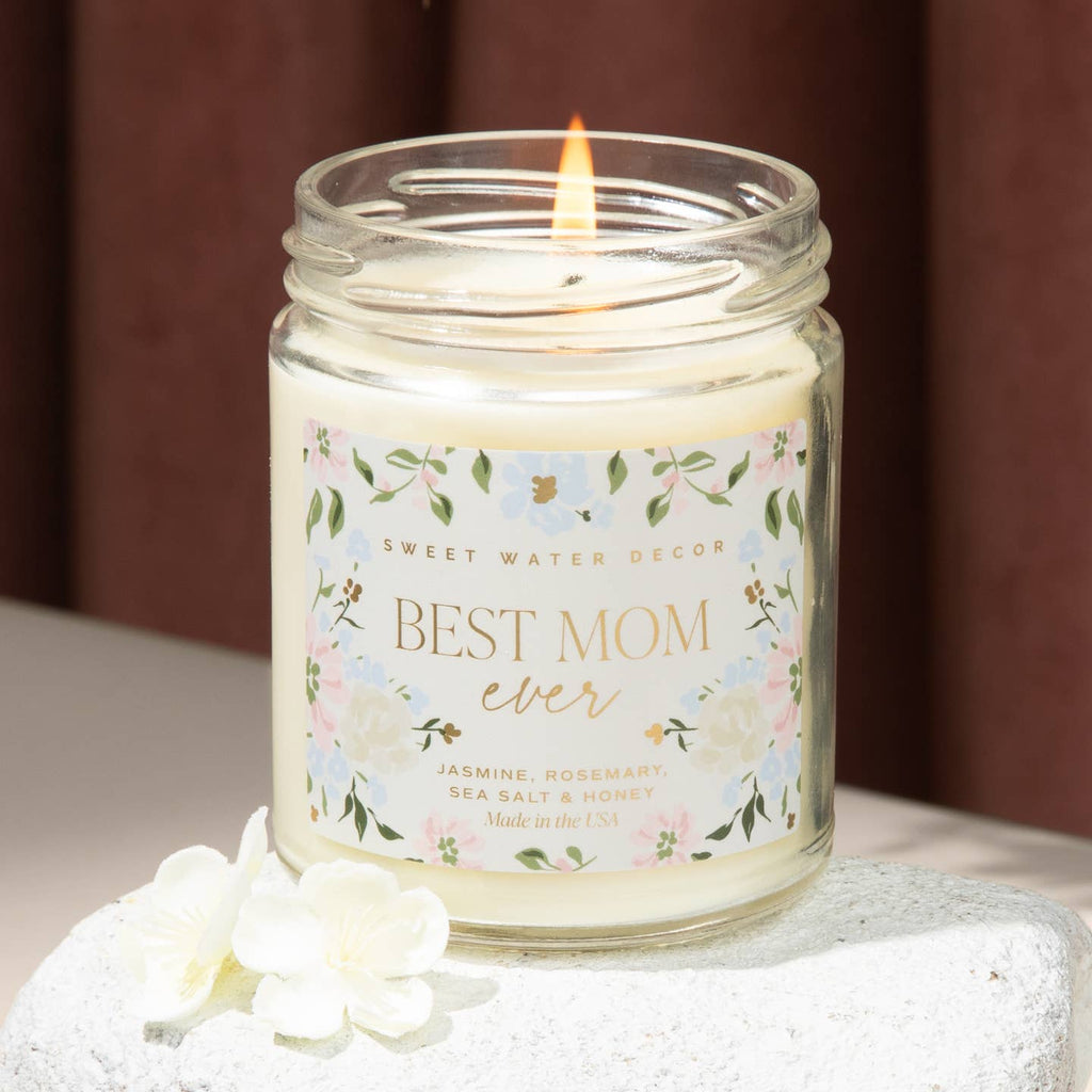 Celebrate the best mom ever with our 9 oz soy candle. The soft floral container adds a touch of elegance to any room. Perfect for Mother's Day or anytime you want to show some love. Enjoy the soothing flicker and comforting aroma of our candle.

Scent Notes:

Top: Lemon, Rosemary, Leafy Green
Middle: Jasmine, Lily, Geranium, Violet
Base: Sea Salt, Amber, Musk
