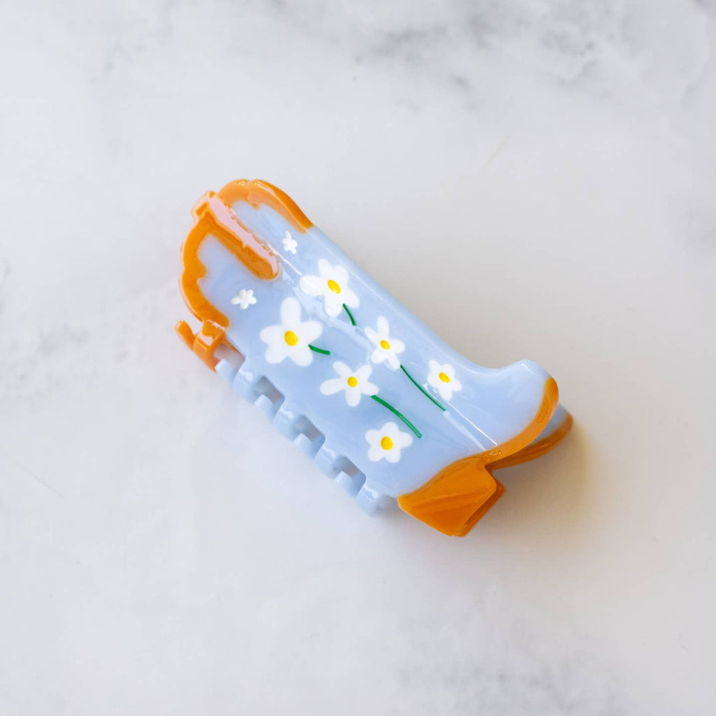 Eco Daisy Flower Cowboy Boots Hair Claw Clip, the perfect accessory for any Western-inspired outfit. Made with sustainable materials, this clip showcases beautiful daisy flowers and features a secure, easy-to-use grip. Upgrade your hair game with this eco-friendly and stylish clip.