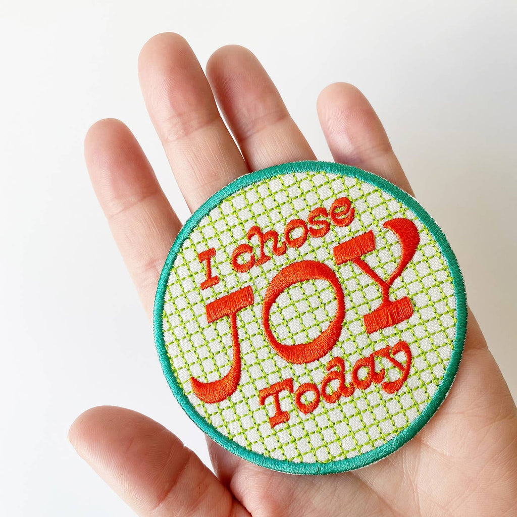 Colorfully embroidered patch measuring 3x3 inches in diameter. Iron-on backing. An inspiring patch that can be used as a badge of honor for kids and adults alike! Iron on to your favorite jean jacket or backpack.