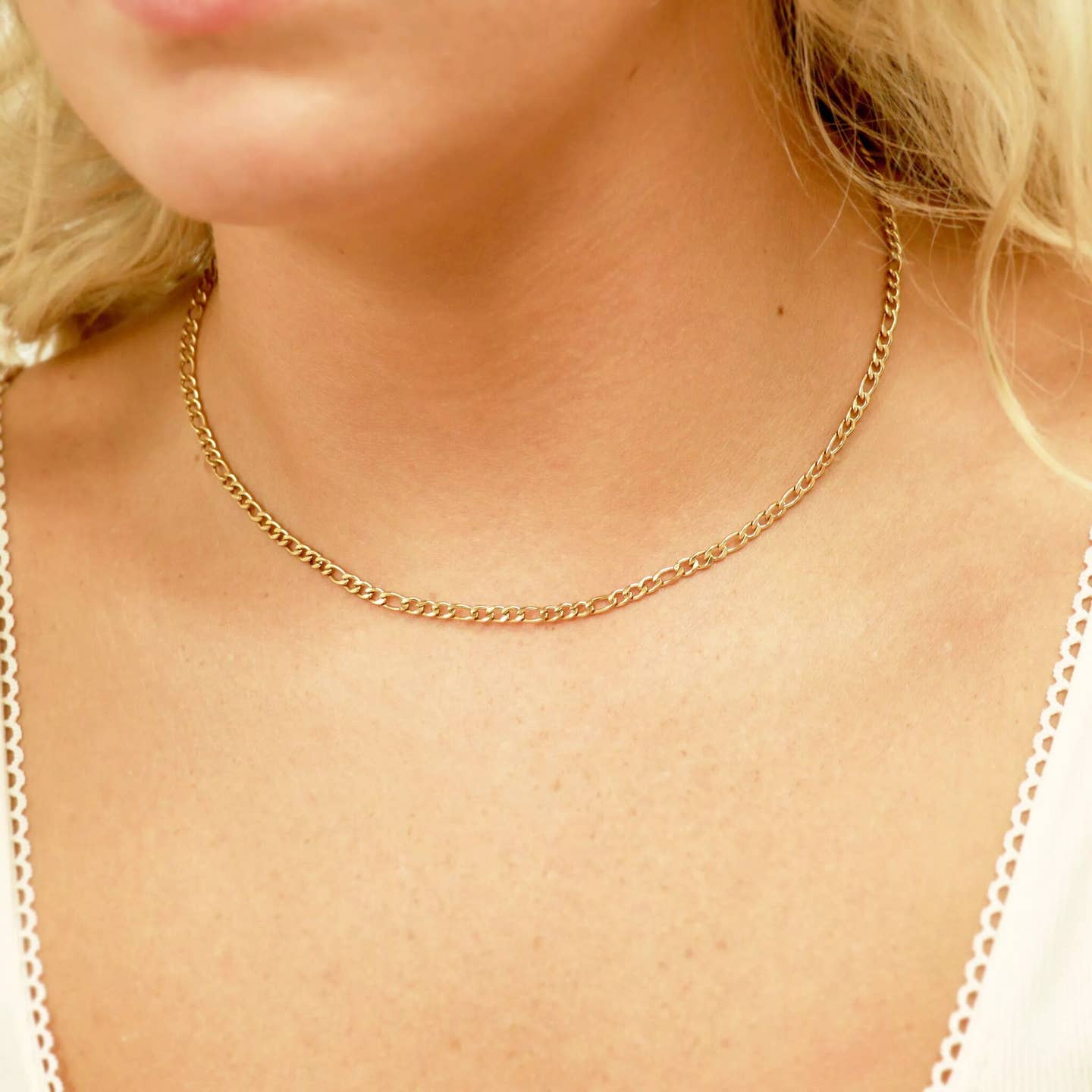 The 18K Gold Figaro Chain Necklace is a classic, timeless staple to carry for every season. This chain is a best seller for men and women that can be worn alone or paired with other chains to achieve the perfect layered necklace look.&nbsp;The Figaro Chain Necklace features a diamond cut flat construction that lays smoothly against the chest for comfortable wear all day long.