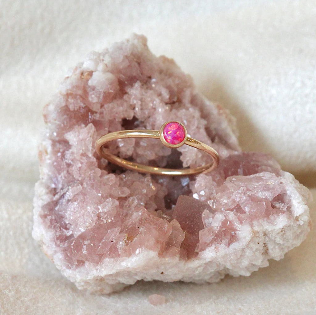 This ring is hand-formed in either sterling silver or 14k goldfill and set with a cultured Cherry Pink opal.&nbsp; Perfect for mixing into a stack or standing out on it's own!