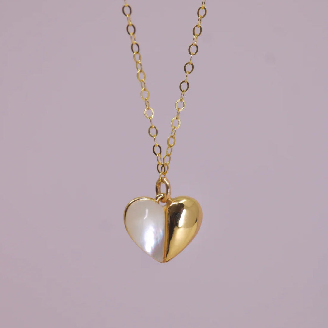 Named after the heart shape on pluto, this necklace is sure to bring love and celestial energy your way. Show your inner heart with this Necklace holding a mother of pearl stone that shimmers and glows.

Strung on 14k Goldfill chain, it won't tarnish or change colors, even with daily wear. This necklace is 16" length with 2" extender. The pendant itself is gold plated with an extra layer of tarnish resistance.