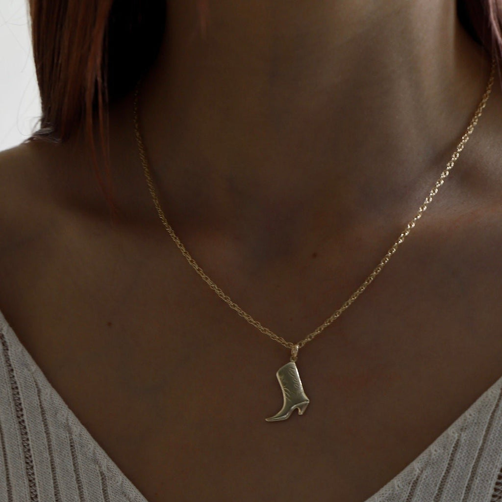 This Cowboy Boot Charm is available in both gold filled and sterling silver options. Crafted with precision and quality, this charm is perfect for any Western-inspired jewelry piece. Add a touch of country flair to your collection with this expertly designed charm.