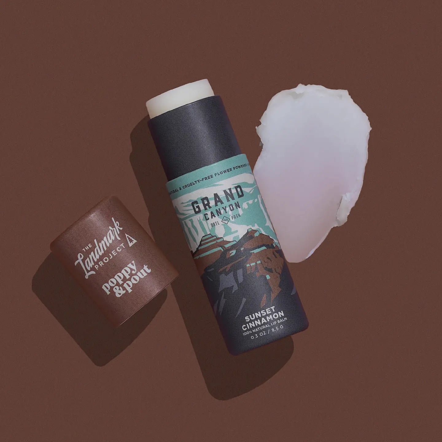 Grand Canyon Sunset Cinnamon: A bold and warm blend of rich cinnamon that evokes the fiery hues of a Grand Canyon sunset. Every Poppy &amp; Pout lip balm is made with 100% natural ingredients and hand-poured into eco-friendly cardboard tubes!

Our natural lip balm formula is as smooth as can be. Each cardboard tube is filled from the bottom to the top with lip hydrating goodness. Ready for more? Gently push up from the bottom to reveal more of your favorite eco-friendly lip balm.