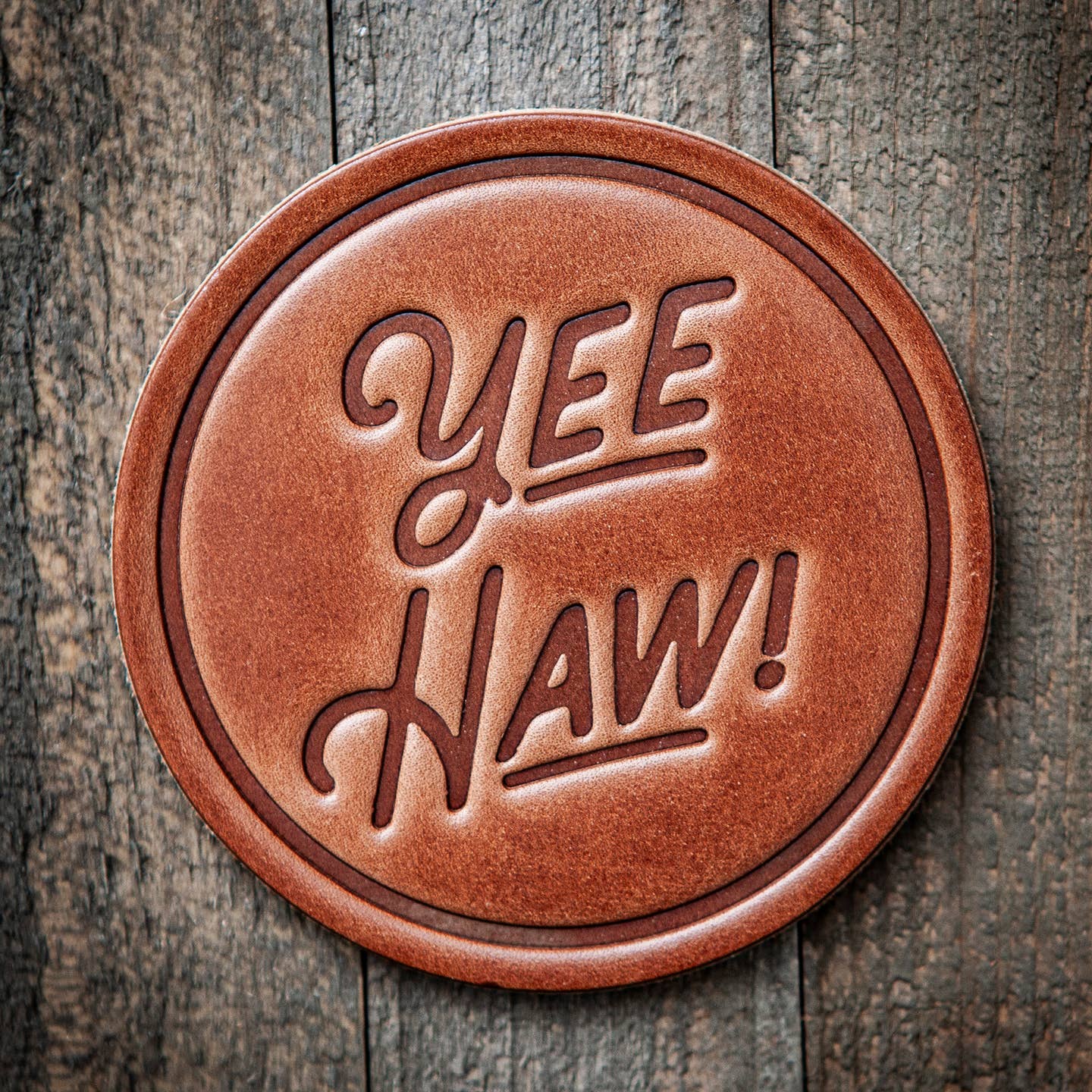 Our leather coasters are cut and pressed by hand from some of the thickest and finest harness leather available. They patina beautifully as they age. Customers love the ability to mix and match a variety of styles to make a classic set of coasters that really says, "I picked these out just for you!"

Size: 4”