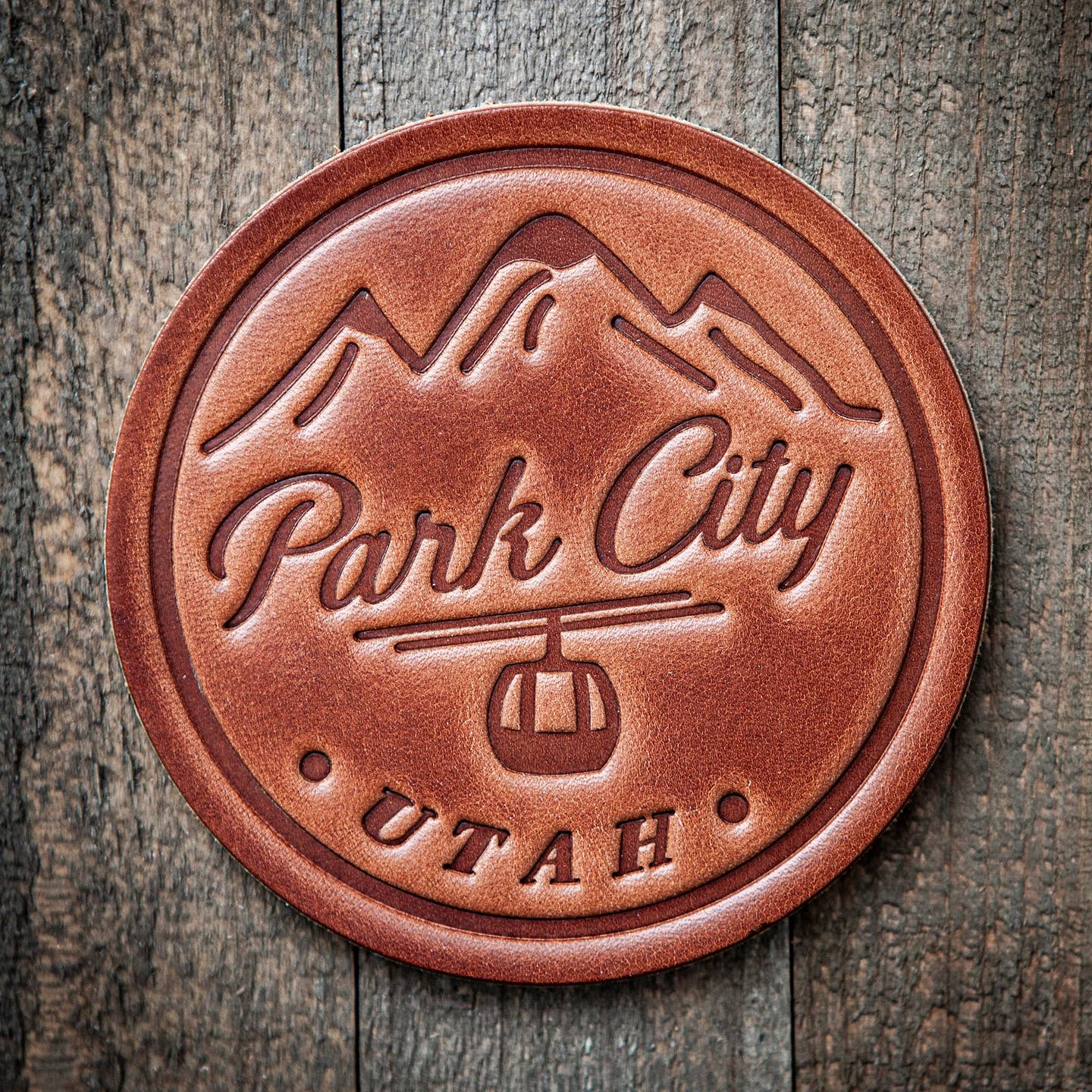 Our leather coasters are cut and pressed by hand from some of the thickest and finest harness leather available. They patina beautifully as they age. Enjoy setting a stack of these on your coffee table or give them as a gift that really says, "I picked these out just for you!"

Size: 4”