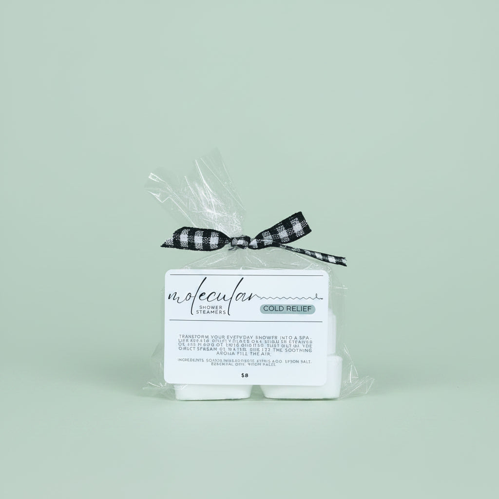 Cellophane bag with 6 square white shower steamers. Tied with a black gingham bow, has a white minimalistic label.
