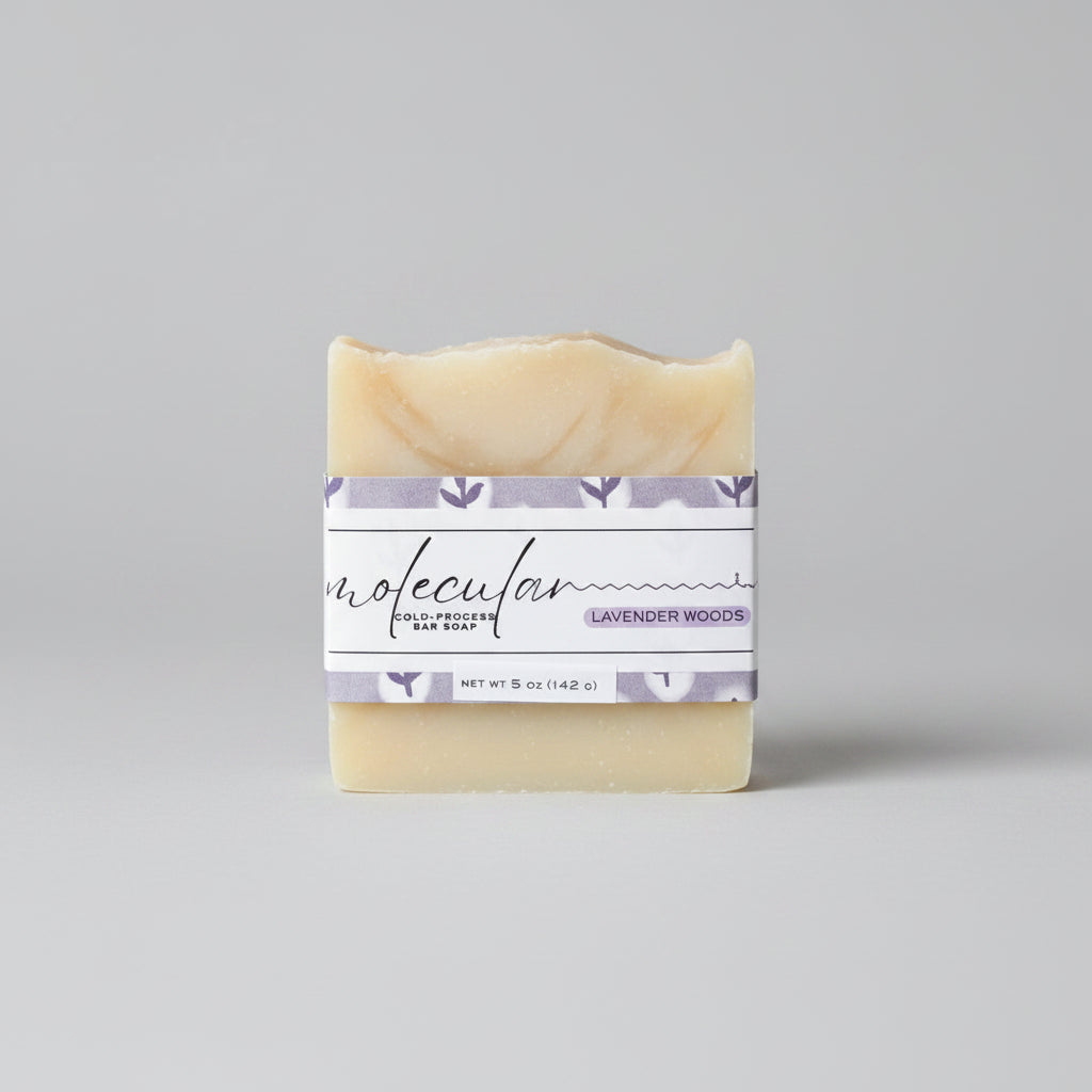 Roughly cut white bar soap with a purple floral label. 