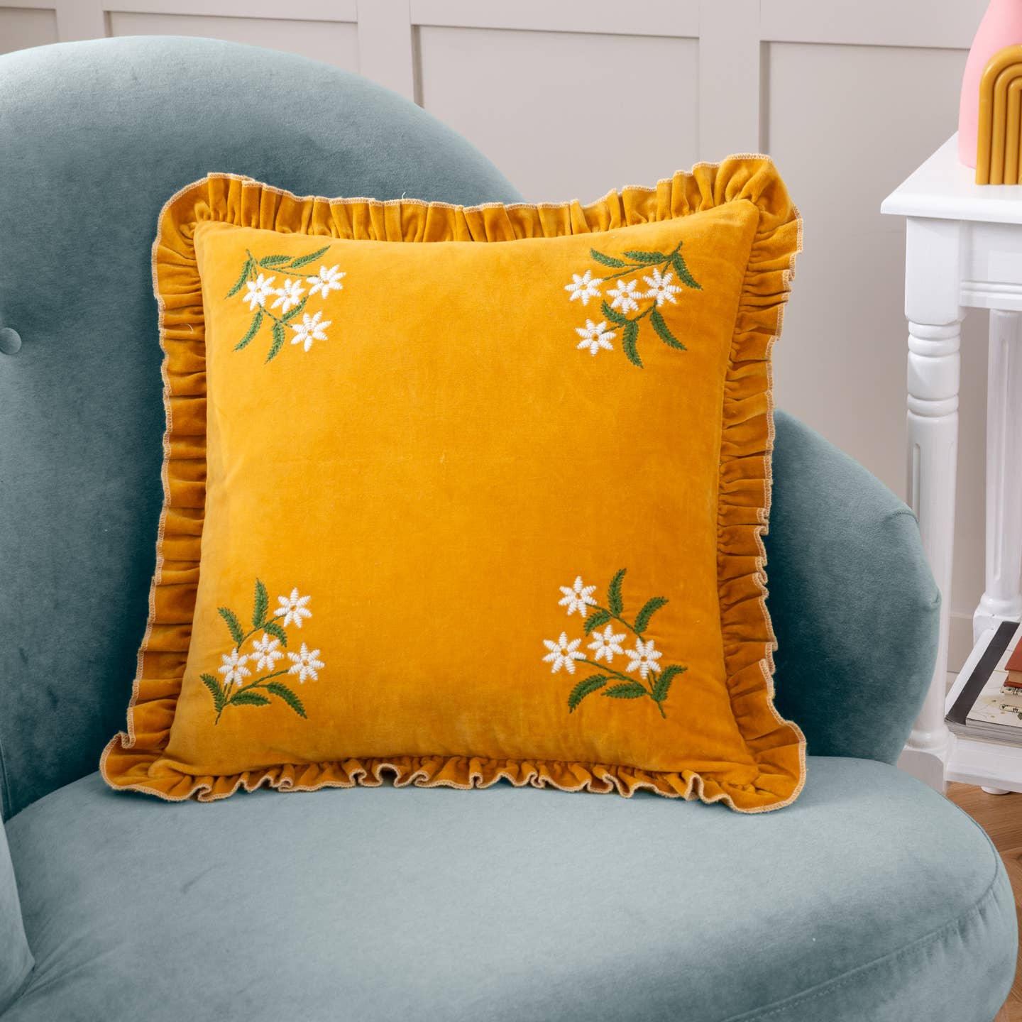 In quintessential British elegance, the Daisy Frill cushion exudes style and class. Featuring delicate embroidered florals that sit gracefully in each corner, are stitched onto a sumptuous soft cotton velvet face, and are surrounded by a chic frilled trim. This exciting piece is ideal for a traditional home that likes to inspire a new age of bashful and blousy textiles in rich, modern colour-drenched tones. Featuring elegant floral embroidery stitched onto a sumptuous cotton velvet.