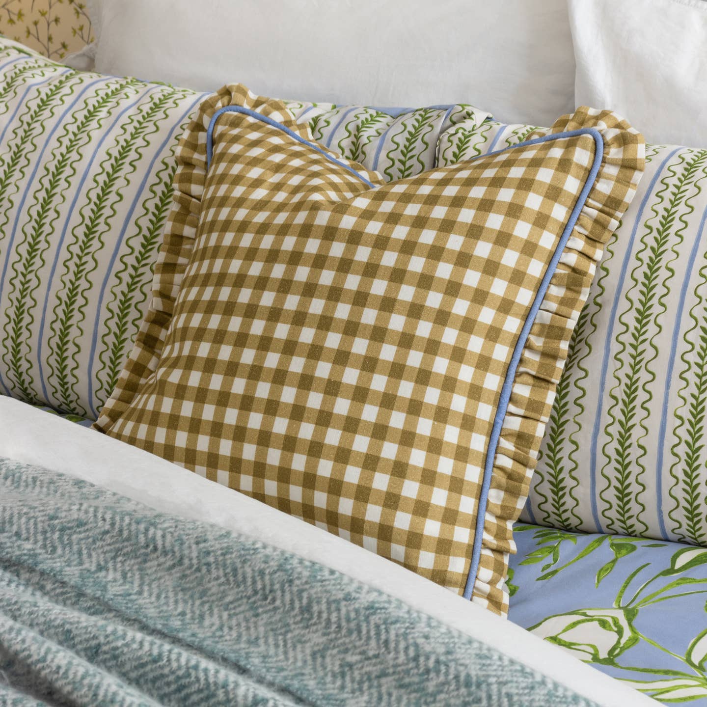 Celebrating traditional designs with an on-trend twist, the Maude Gingham cushion is a standout piece that is ideal for the summer months. With a check pattern in a golden hue, this design boasts both a piped and frilled trim, which finishes the design superbly. A seasonal delight to place on your sofa during those long, hot sunny days.
