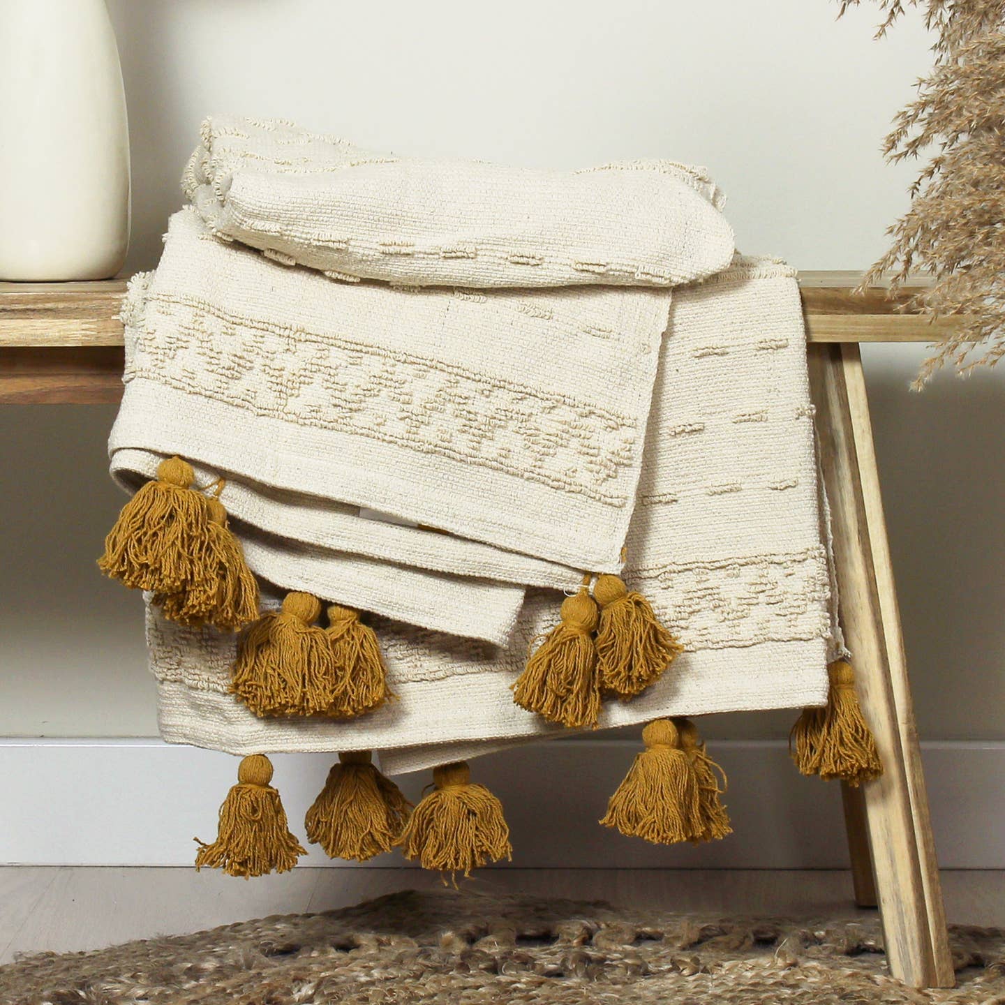 Add some personality and style to your home with the Boho cotton woven throw, featuring contrast colour tassels on two sides and tufting detail. A natural coloured base makes this a versatile throw for any home.