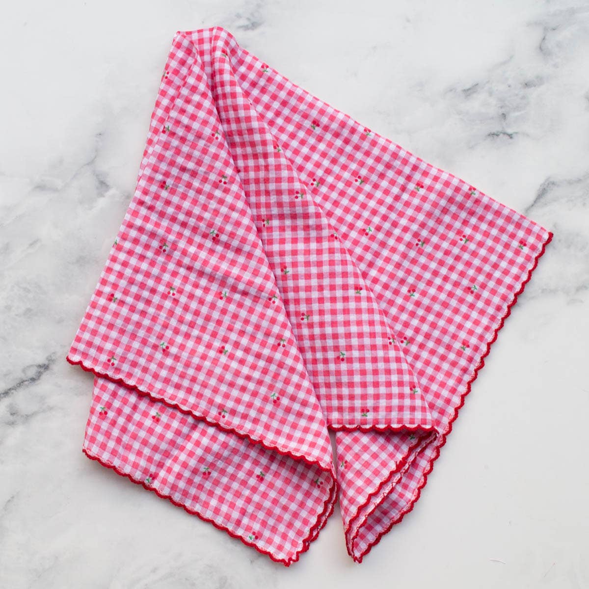 This Cottage Mini Checker scarf features delicate tiny cherry patterns woven into a soft blend of cotton and rayon, offering lightweight comfort and breathability. Its classic pink color adds a versatile touch to any outfit, perfect for adding a subtle pop of charm while keeping you cozy throughout the day.