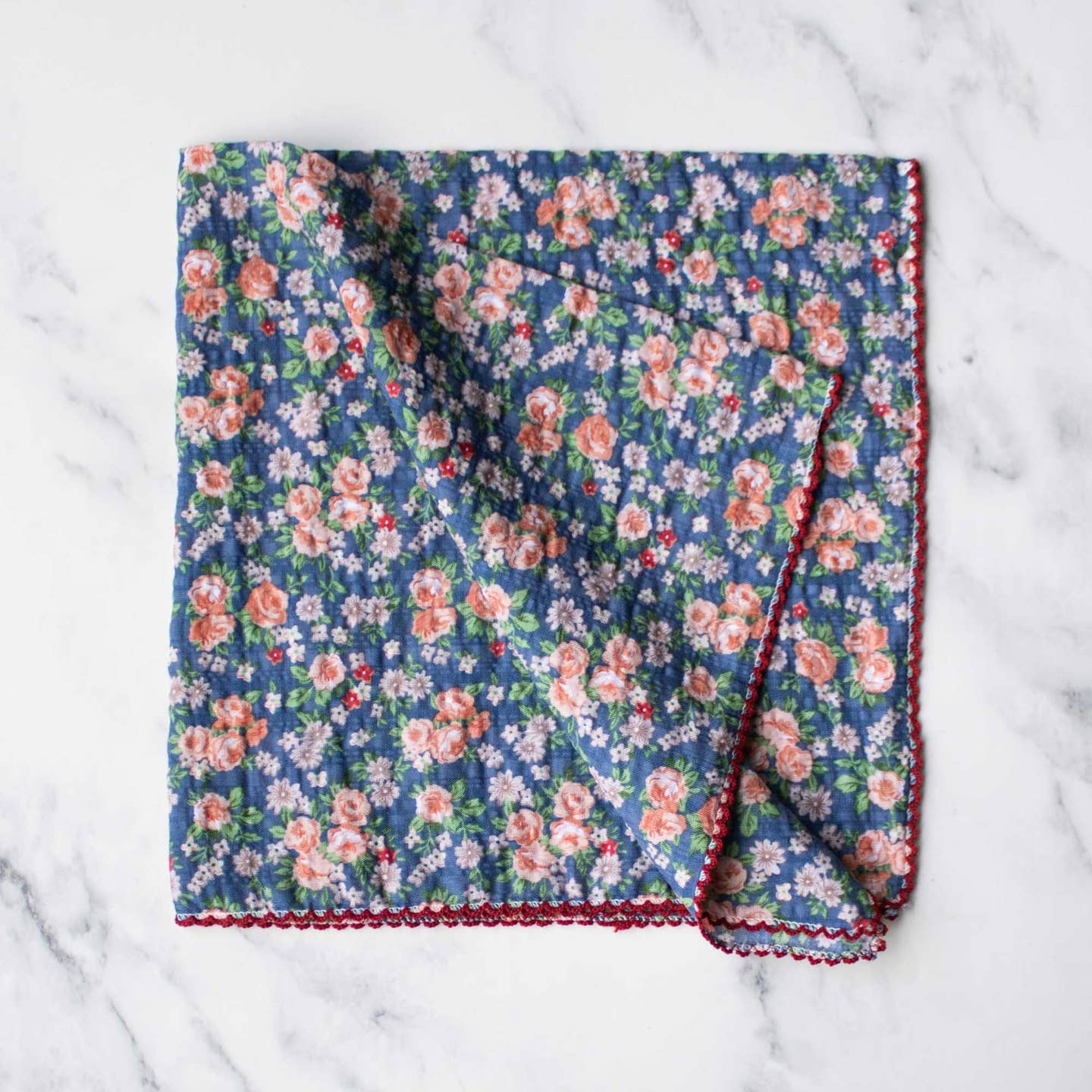 Wrap yourself in timeless elegance with the Rose Garden Cotton Scarf in a rich denim blue color. Featuring a vintage rose pattern, this scarf adds a gentle, feminine touch to any outfit. Its lightweight cotton fabric offers breathable comfort for all-day wear and versatile styling options—whether draped around your neck, tied to a bag, or used as a headscarf. Perfect for enhancing your look with subtle charm and cozy ease.