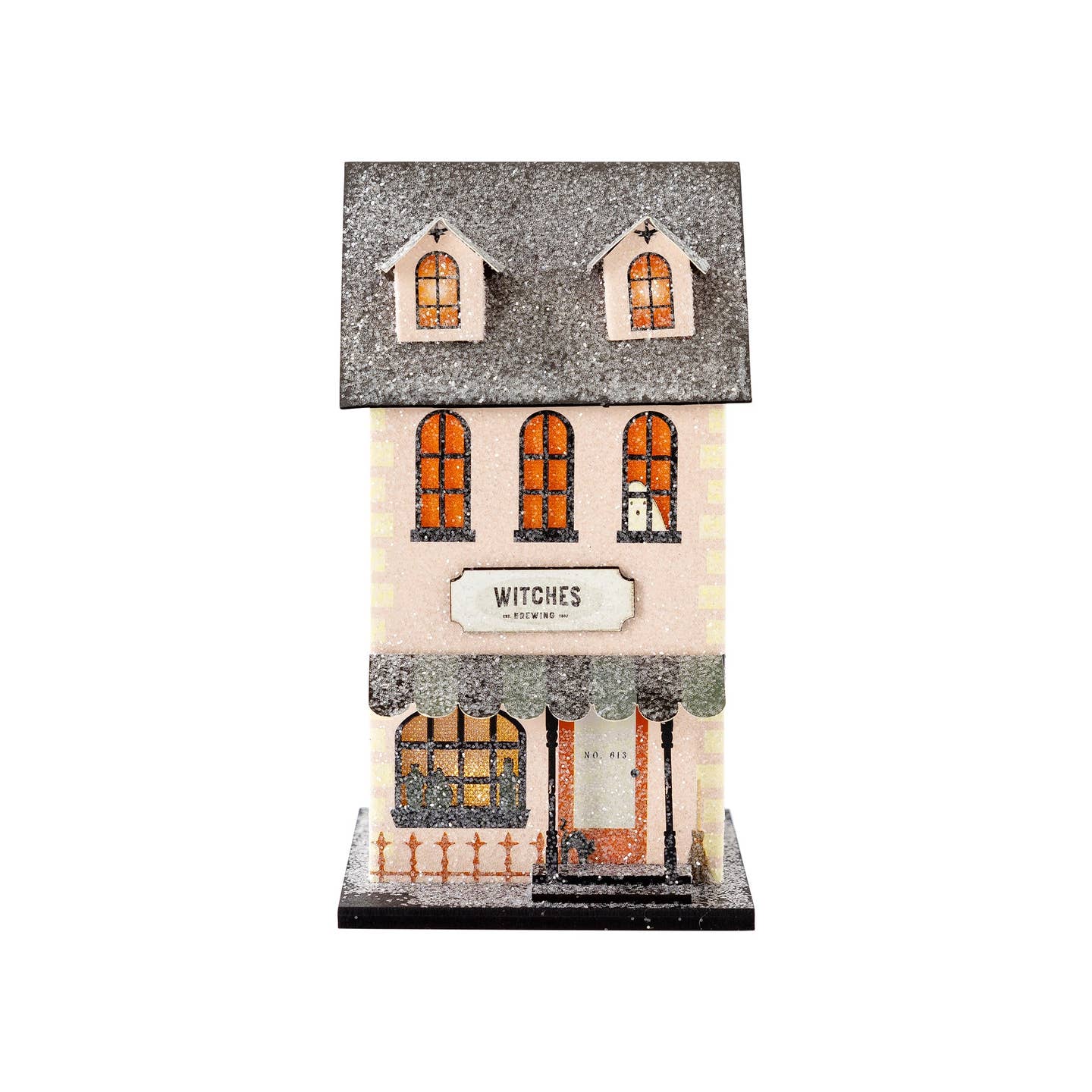 Get ready for some wicked fun with our Witches Brewing haunted village house. Imagine the witches working their magic, brewing up some spooky potions. Perfect for all your Halloween decorating needs.

Details:

House is 4" wide x 3.25" deep x 7.5" tall
Constructed of heavyweight paperboard with glitter accents
includes battery powered light inside (please keep out of reach of small children)