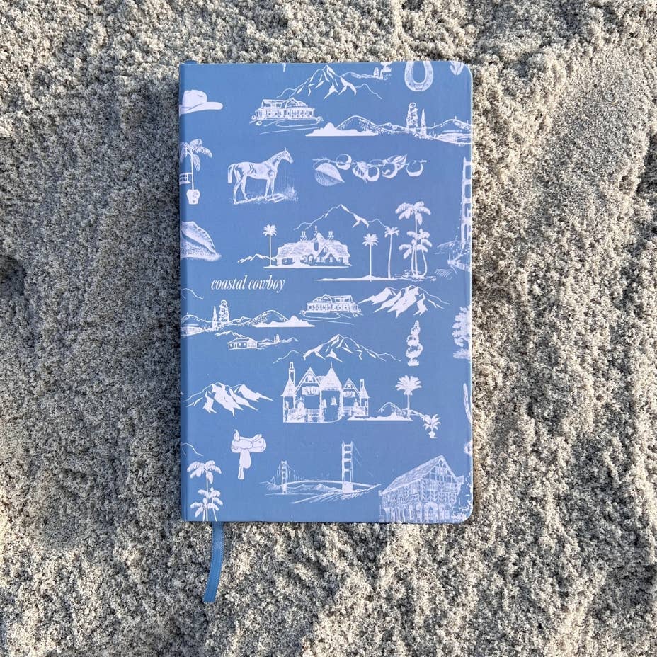 Capture your coastal dreams, cowboy style. Our Toile Coastal Cowboy® Lined Notebook combines southern charm with breezy coastal vibes, making it a unique journal for all your thoughts, plans, and sketches.

The wrap-around cover features our signature toile pattern with classic Western and coastal accents, bringing a bit of the wild to the shore. Each page is lined for organized writing, and the sturdy binding makes it durable enough to take on all your adventures. 