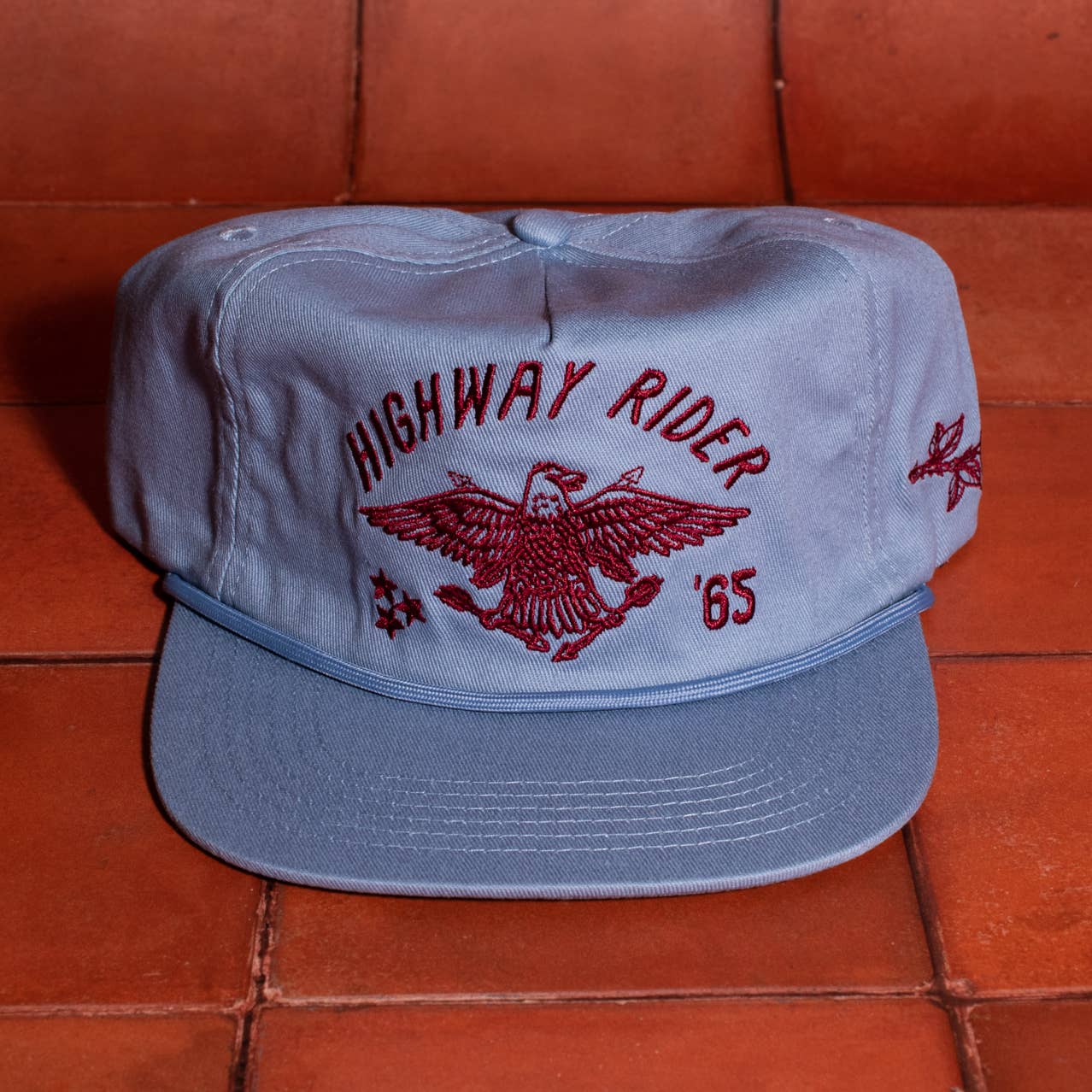 Embrace a timeless edge with the Highway Rider Vintage Snapback Hat. Featuring an embroidered “highway rider” script and a striking eagle design, this blue SnapBack blends classic style with durable comfort. Its adjustable fit ensures it feels just right, making it a dependable choice for everyday wear or your next adventure.