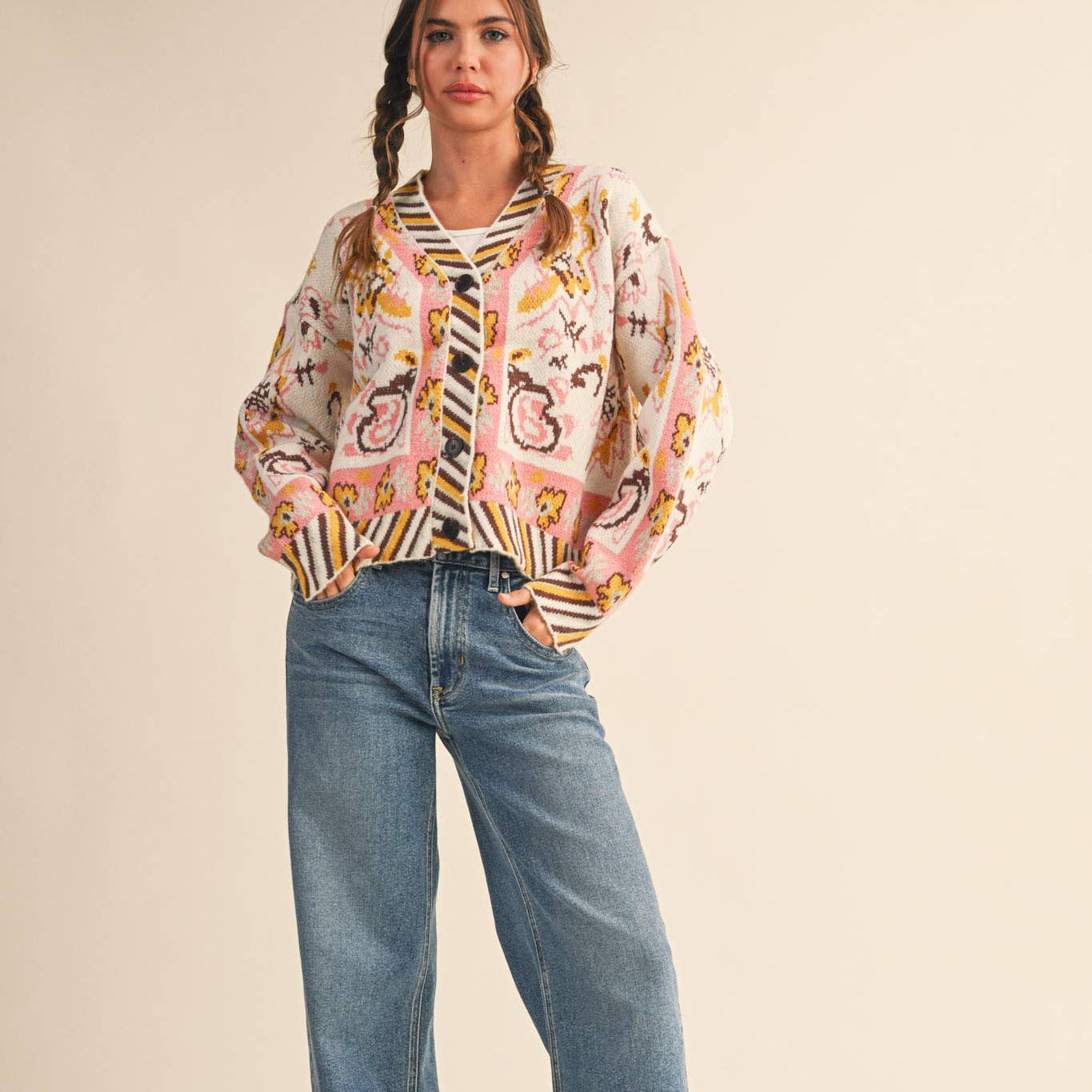 This Paisley Knit Sweater Cardigan in ivory and coral offers a cozy and stylish layer for cooler days. Its soft knit fabric provides warmth and comfort, while the elegant paisley pattern adds a timeless touch to your wardrobe. Perfect for casual outings or relaxed office settings, this cardigan blends versatility with gentle support to keep you comfortable all day long.