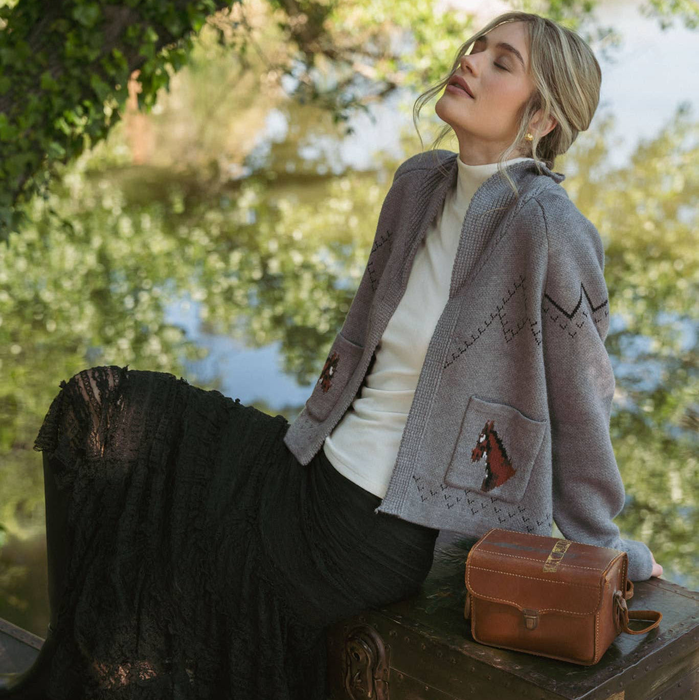 Stay comfortable and stylish with this dark grey knit cardigan featuring a relaxed fit for easy layering. The charming horse detail on the back and front pocket adds a unique, thoughtful touch to your casual wardrobe. Perfect for cozy days, this cardigan offers warmth without sacrificing breathability, making it an ideal companion for both indoor and outdoor wear.