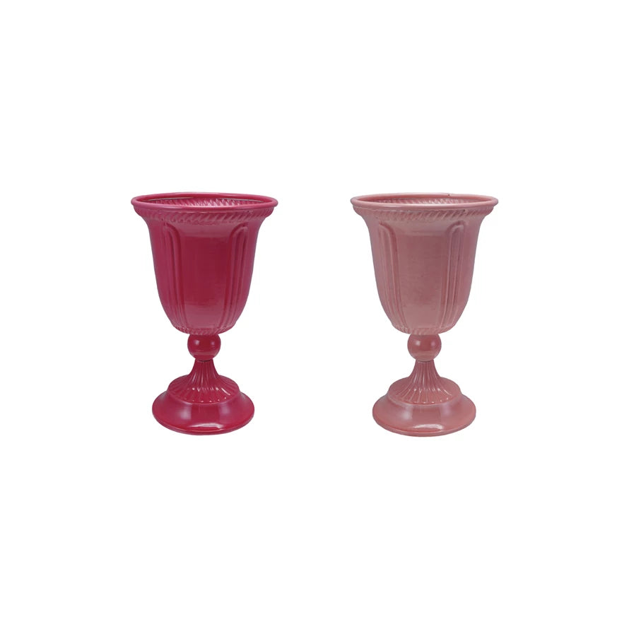 Add a pop of color to your space with this painted pink metal footed planter, available in vibrant hot pink or soft light pink. Crafted from durable iron, it offers sturdy support for your favorite plants while elevating them with its charming footed design. Perfect for brightening any room or patio, this planter combines style with function to help your greenery thrive.