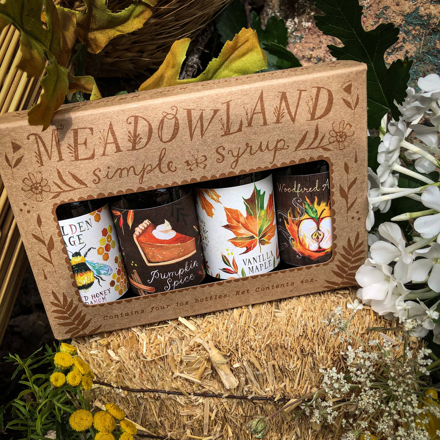 A warm and cozy collection of 4 of our favorite fall simple syrups! Perfect in your cocktails, coffee, sparkling water, or even baked goods! :) In this kit, you'll receive four-1 oz bottles of the following:

Pumpkin Spice: fresh pumpkin pie, warm cinnamon, crisp autumn leaves, afternoon glow.
Vanilla Maple: Autumn sun, a crisp breeze, warm maple syrup.
Woodfired Apple: Crisp autumn apples, a crackling fire, soft cinnamon, spicy clove, a twilit sky.
Golden Age: Golden honey, salt breeze, afternoon sun.