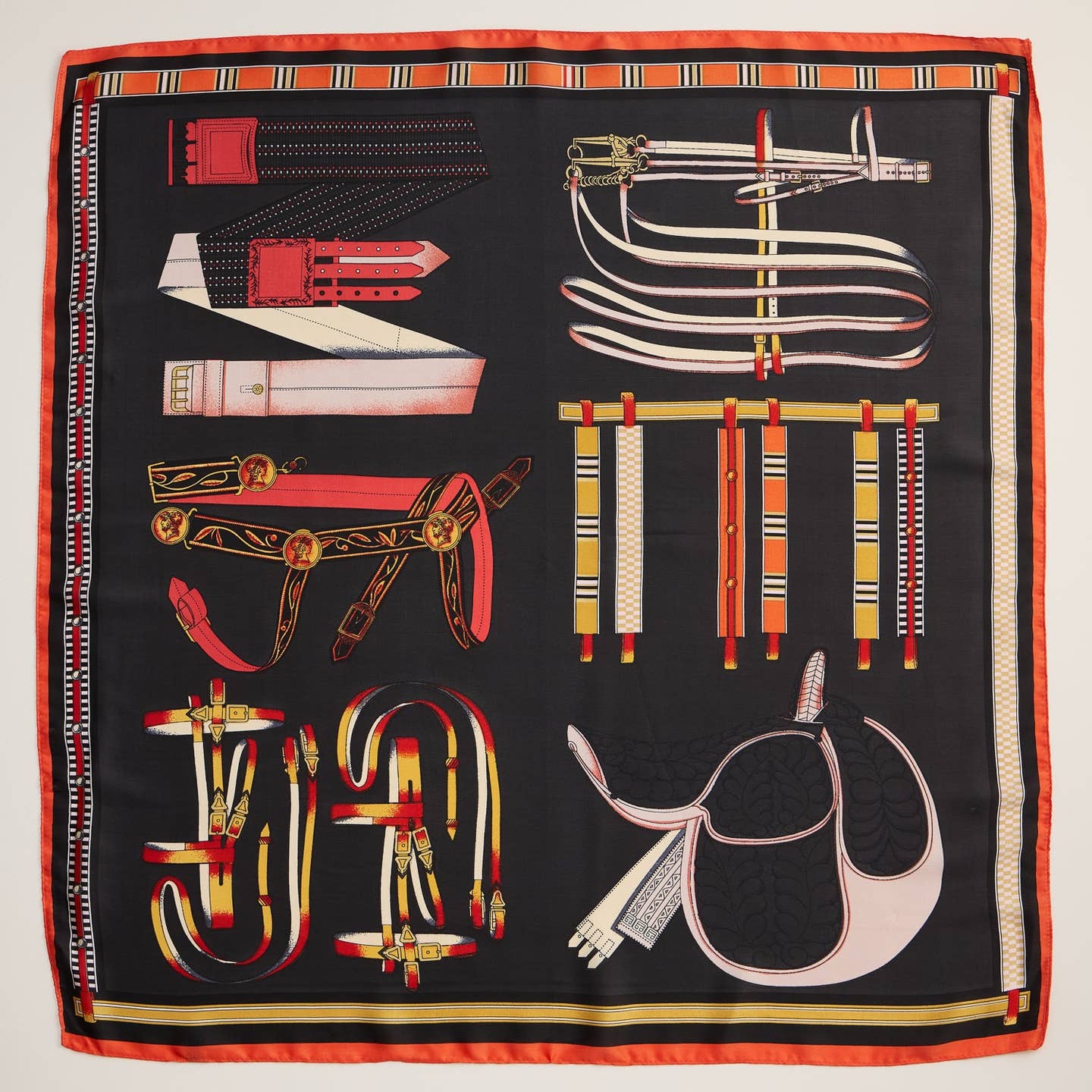 Elevate your wardrobe with this equestrian-inspired square scarf, featuring an intricate vintage saddle, bridle, and tack print. Crafted from high-quality polyester with a silk-like texture, this scarf offers a luxurious feel while remaining lightweight and easy to style. The bold colors and refined design make it a statement piece that adds a touch of classic elegance to any outfit.