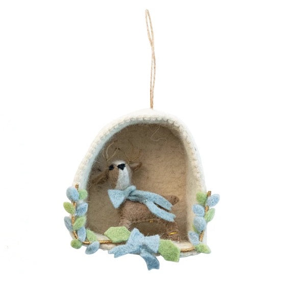 Decorative ornament of a deer with blue flowers on a white background