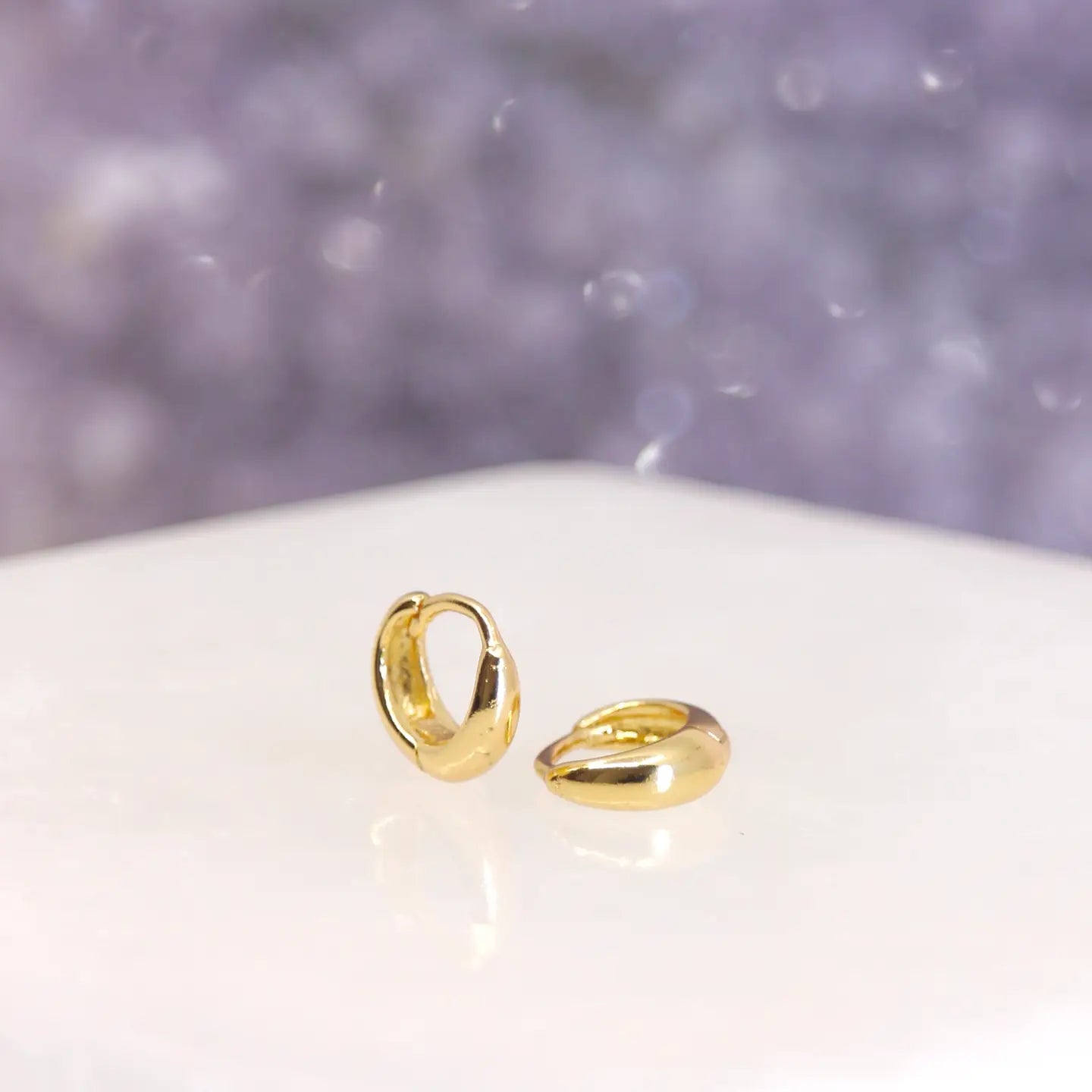 These sweet and simple teeny hoops are named after Castor, the second-brightest star in the Gemini Zodiac constellation. It is a system of six gravitationally bound stars, but appears as one to the naked eye.