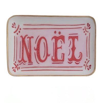 Decorative sign with 'NOEL' in red on a white background
