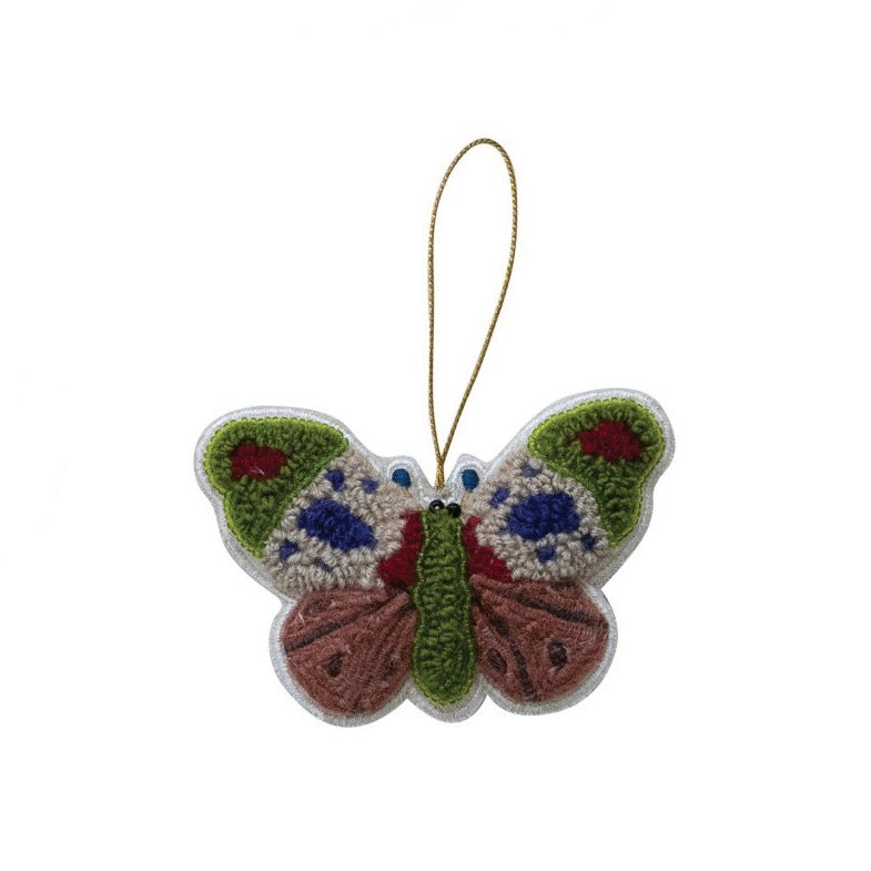 Decorative butterfly ornament with a string on a white background