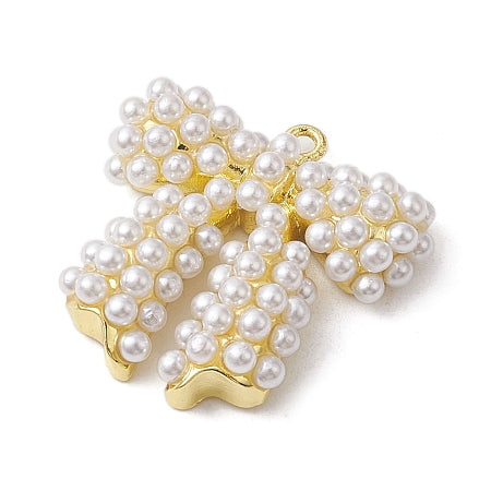 The Pearl Bow Charm combines classic elegance with a touch of whimsy, featuring a graceful bow adorned with lustrous pearls. Designed to enhance any bracelet or necklace, this charm adds a refined, feminine accent that effortlessly complements your everyday look or special occasions.

Details:

Long-Lasting Real 18K Gold Plated Plated, Lead Free &amp; Cadmium Free
Size: 21x21.5x5mm, hole:1.4mm
Material: Brass+Plastic