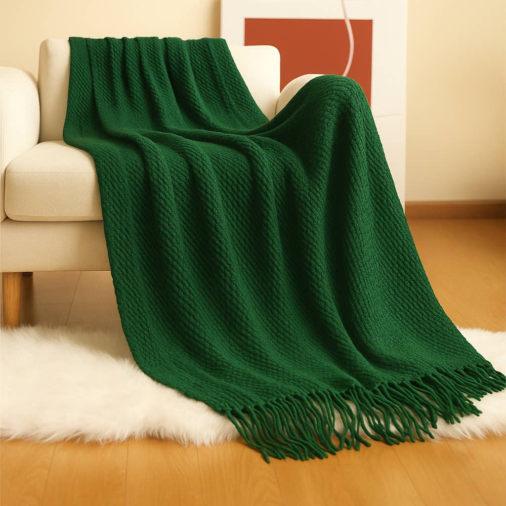 Add a pop of color and cozy texture to your space with this beautifully crafted teal throw blanket. Designed in a rich waffle-knit pattern, it offers both warmth and style, perfect for layering over a sofa, accent chair, or bed. The soft acrylic knit is finished with playful fringe detailing that lends a relaxed, boho-inspired touch to your home decor. Ideal for all seasons, this textured throw is as functional as it is stylish—perfect for cozy nights in or as a decorative accent year-round. Size 50” x 60” 