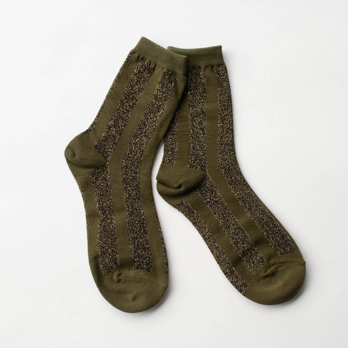 Make a statement with these striking crew socks showcasing bold vertical stripes in olive, enhanced with eye-catching glitter accents. Designed to bring sparkle to your everyday wardrobe, these socks combine playful style with dependable comfort. The crew-length cut provides excellent support and coverage for all-day wear, whether you're heading to the office, out on adventures, or simply relaxing at home. Slip them on and let your feet do the talking with this fun, versatile essential.