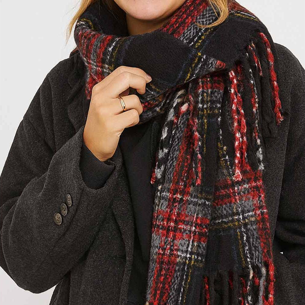 Wrap yourself in warmth and style with this black plaid knit scarf. Crafted from soft, cozy yarn with a classic plaid pattern, it's the perfect layering piece for cooler days. The fringed ends add a charming, finished touch that elevates any outfit. Whether you're heading out for a casual stroll or dressing up your everyday look, this versatile scarf brings both comfort and character to your wardrobe.

Details:

100% Polyester
Casual, light fitting scarf
Size: 40*185cm