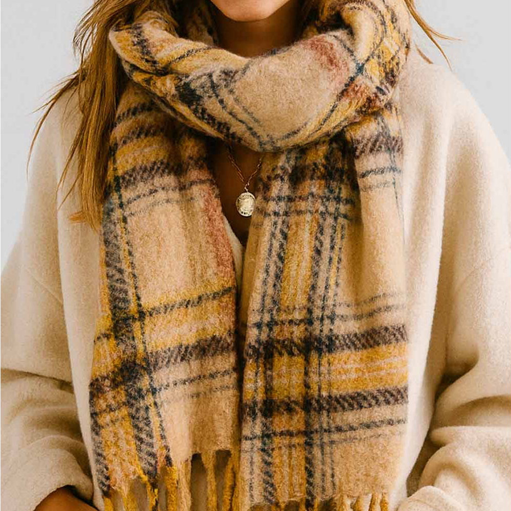 Wrap yourself in warmth and style with this light khaki plaid knit scarf. Crafted from soft, cozy yarn with a classic plaid pattern, it's the perfect layering piece for cooler days. The fringed ends add a charming, finished touch that elevates any outfit. Whether you're heading out for a casual stroll or dressing up your everyday look, this versatile scarf brings both comfort and character to your wardrobe.

Details:

100% Polyester
Casual, light fitting scarf
Size: 40*185cm