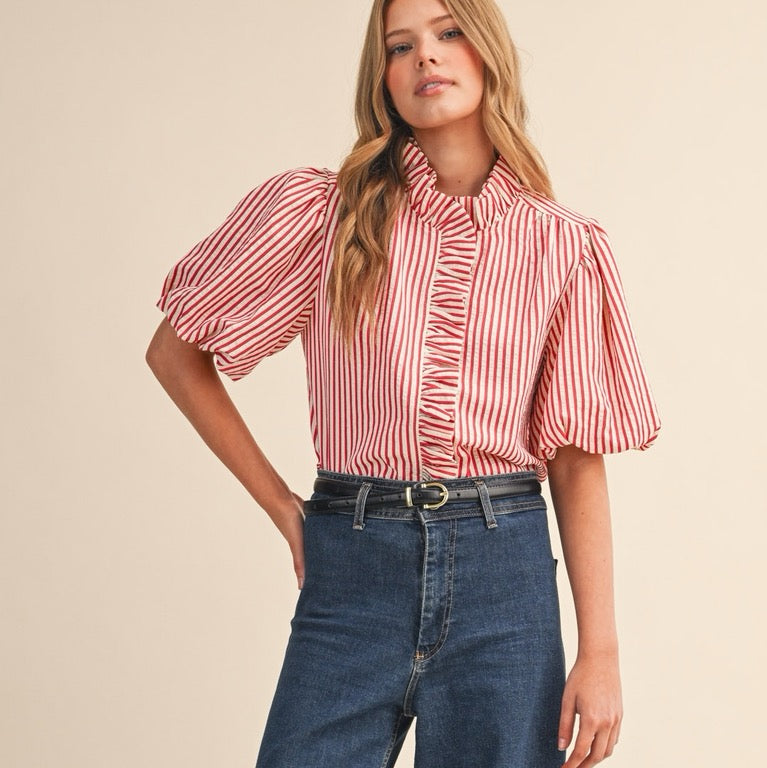 Elevate your everyday wardrobe with this charming berry red striped button-down blouse. The delicate ruffled detailing adds a touch of feminine flair, while the classic pin stripe pattern keeps things polished and versatile. Short sleeves make it perfect for layering or wearing solo during warmer months. The functional button-down front allows for easy styling—wear it buttoned up for a put-together look or leave it partially open over a camisole for effortless sophistication. A wardrobe essential that works