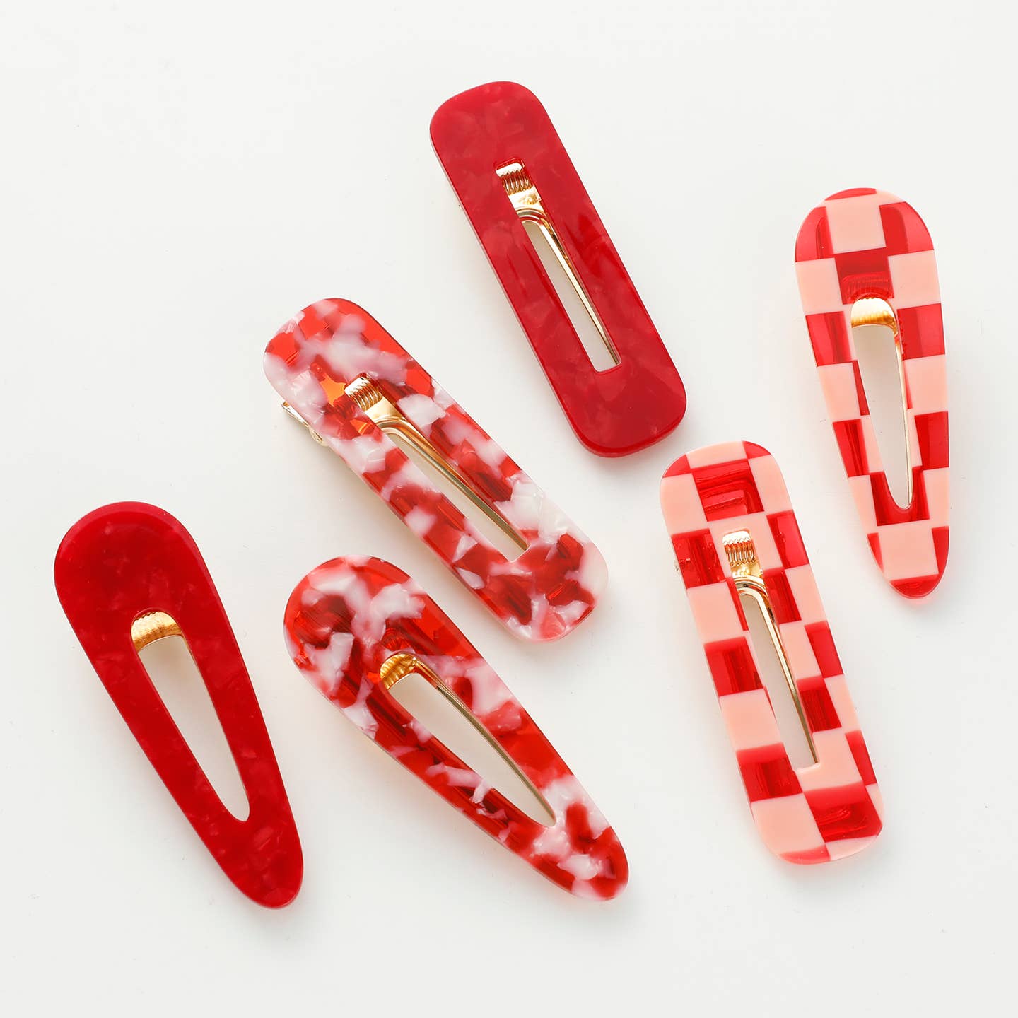 Embrace the spirit of Valentine's Day with the Gemma Valentine Barrette Hair Clip Set—a thoughtfully curated pair of small hair clips chosen just for you. We've handpicked a surprise combination from our romantic collection featuring checkered, red and white tortoise, and solid red designs. Let us delight you with our selection and add an unexpected touch of love to your accessory collection. Each clip delivers a secure, comfortable hold perfect for any occasion. A wonderful way to treat yourself.