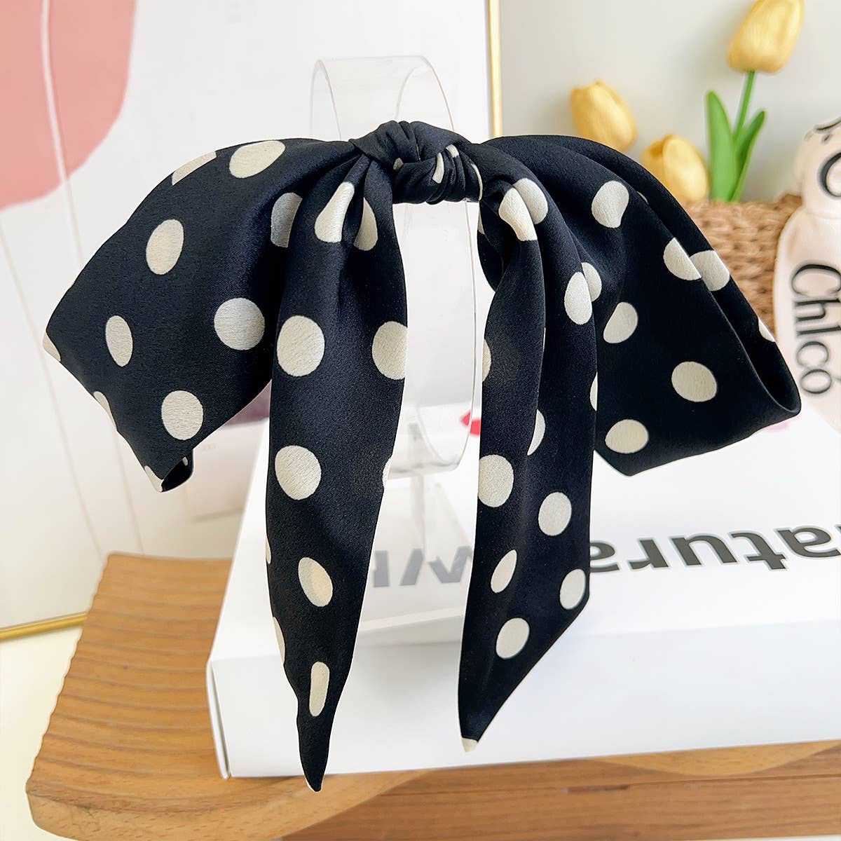 Make a statement with this charming French barrette featuring a classic black and white polka dot pattern. The elegant satin bow with flowing tails adds a touch of sophistication to any hairstyle, while the large clip size provides a secure hold for thick or voluminous hair. Perfect for creating polished updos, half-up styles, or simply adding a vintage-inspired accent to your everyday look. This timeless piece brings effortless elegance and playful style together.

Details:

6cm x 34cm